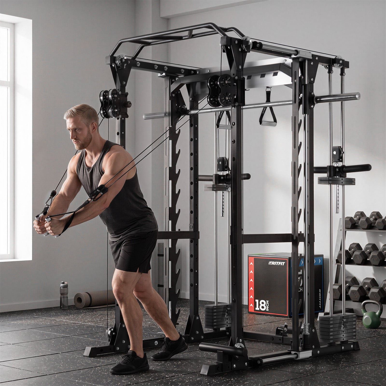 Man using black RitFit P9 Multi-Functional Modular Power Cage with 3D Smith Machine and dual cable system