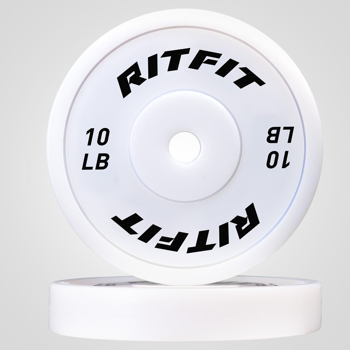 White RitFit PE weight plates showing 10 LB black text on smooth surface