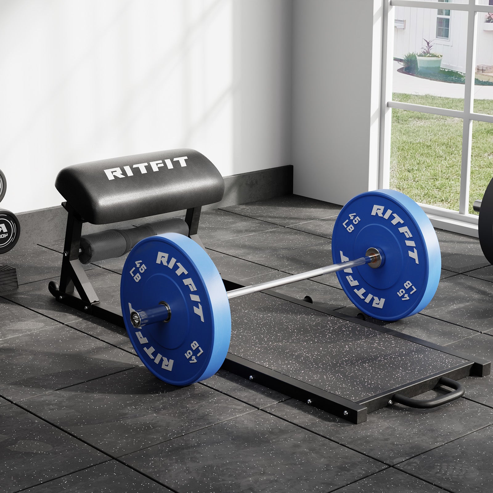 Black RitFit PHM02 Hip Thrust Machine with blue bumper plates on gym floor