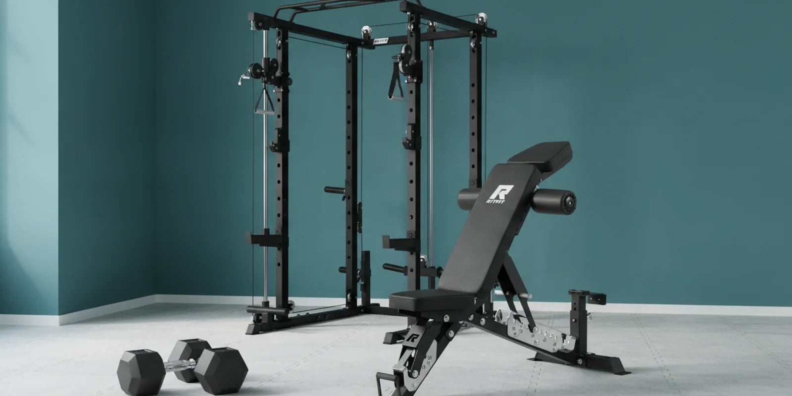 Freshly painted home gym interior with RitFit power cage, adjustable weight bench, and hex dumbbells