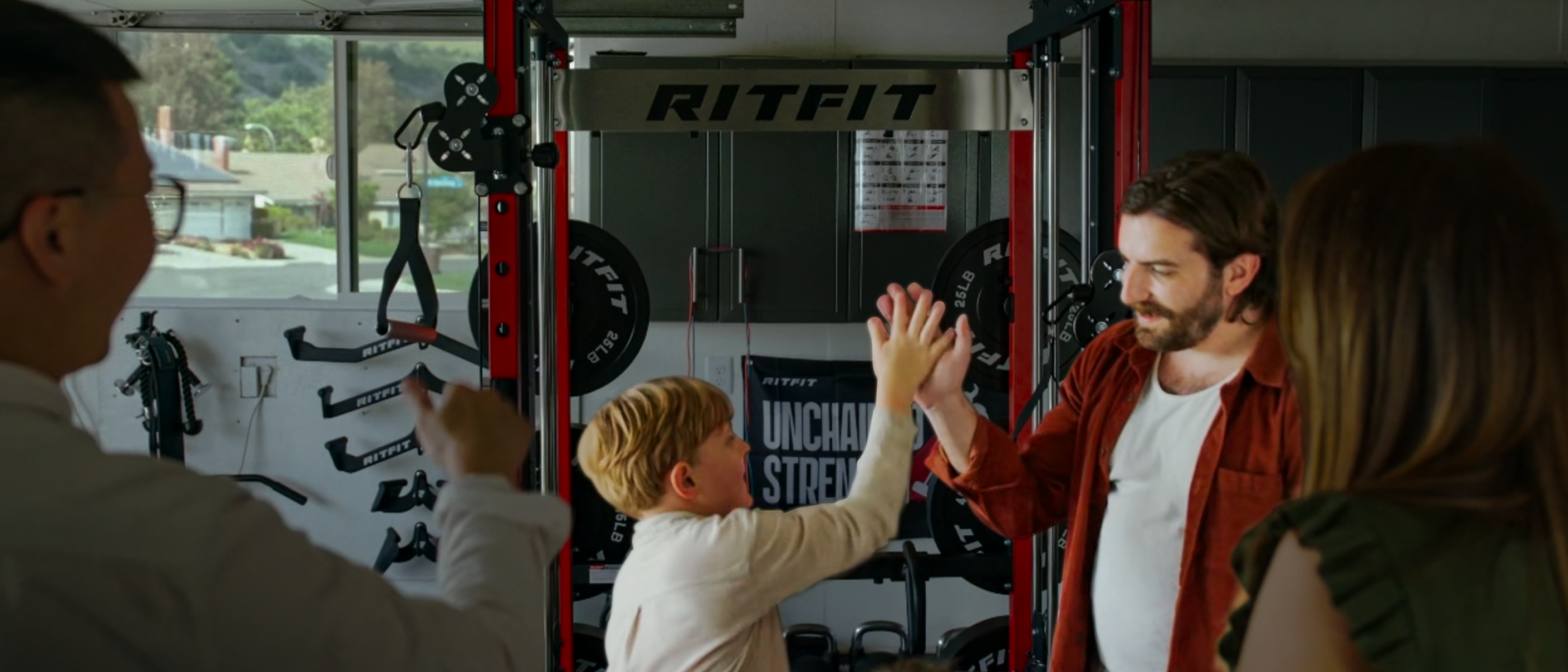Group of people in a gym setting with a RITFIT machine in the background