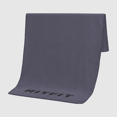 RitFit sports towel folded on gym bench, soft microfiber accessory for workouts and sports activities.