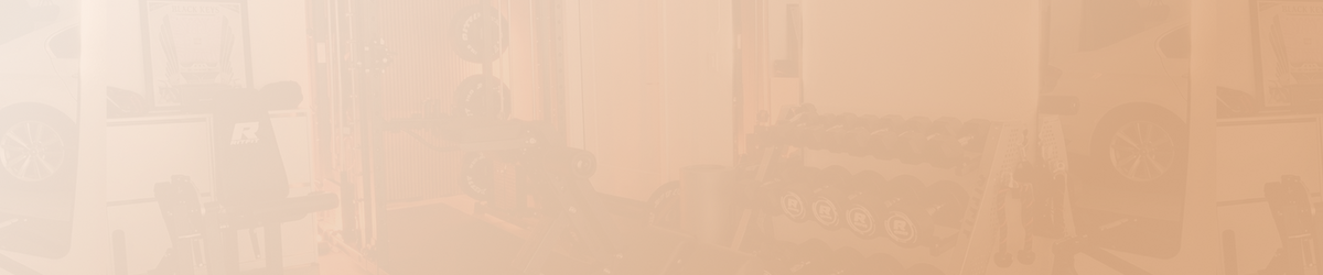 Home gym equipment including weight bench and dumbbell rack in garage setting