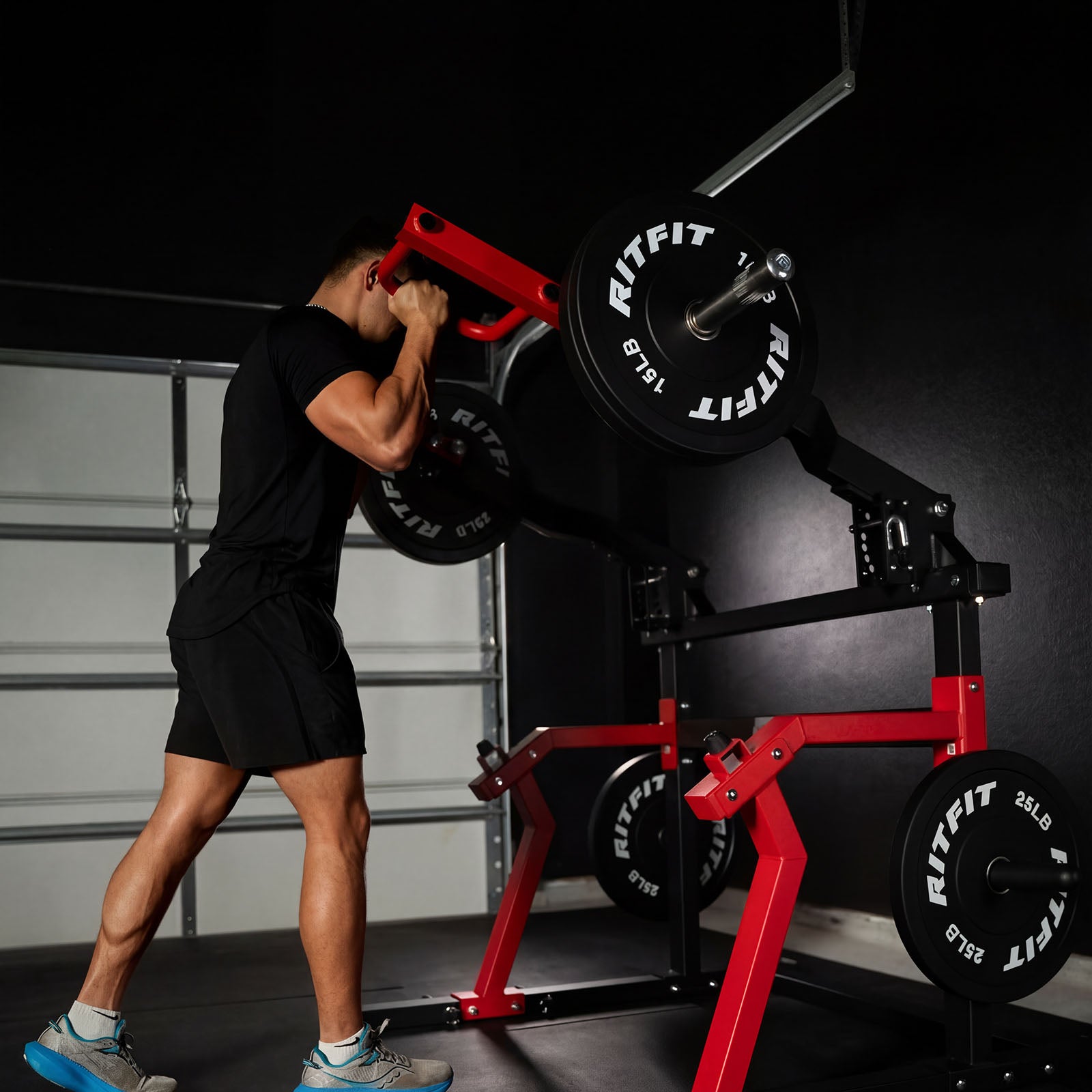 Person lifting weights on a RitFit Gorilla 2-in-1 chest and shoulder press machine