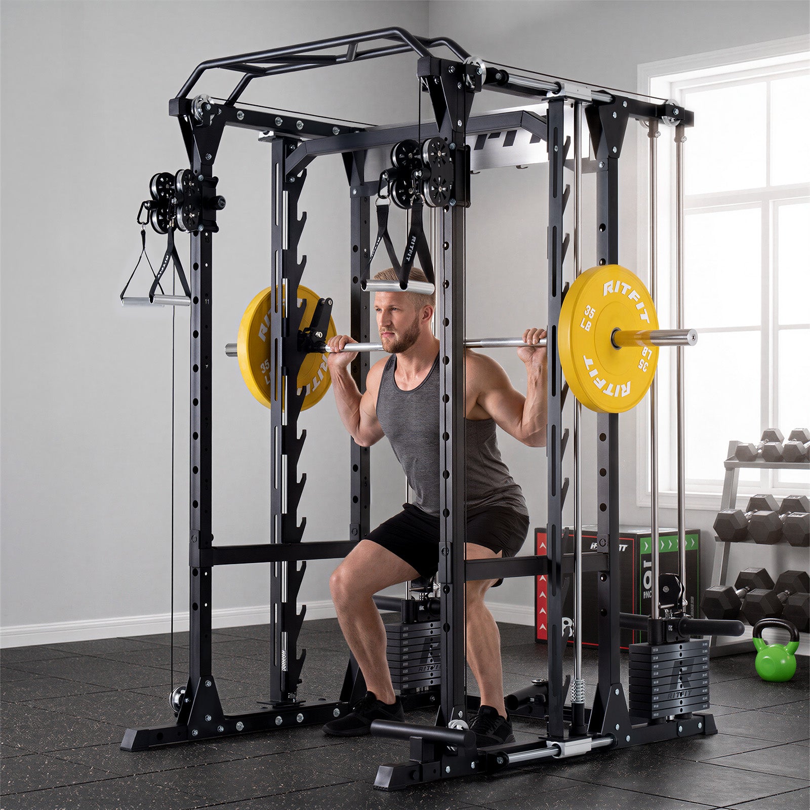Man squatting with barbell inside black RitFit P9 Multi-Functional Modular Power Cage with 3D Smith Machine