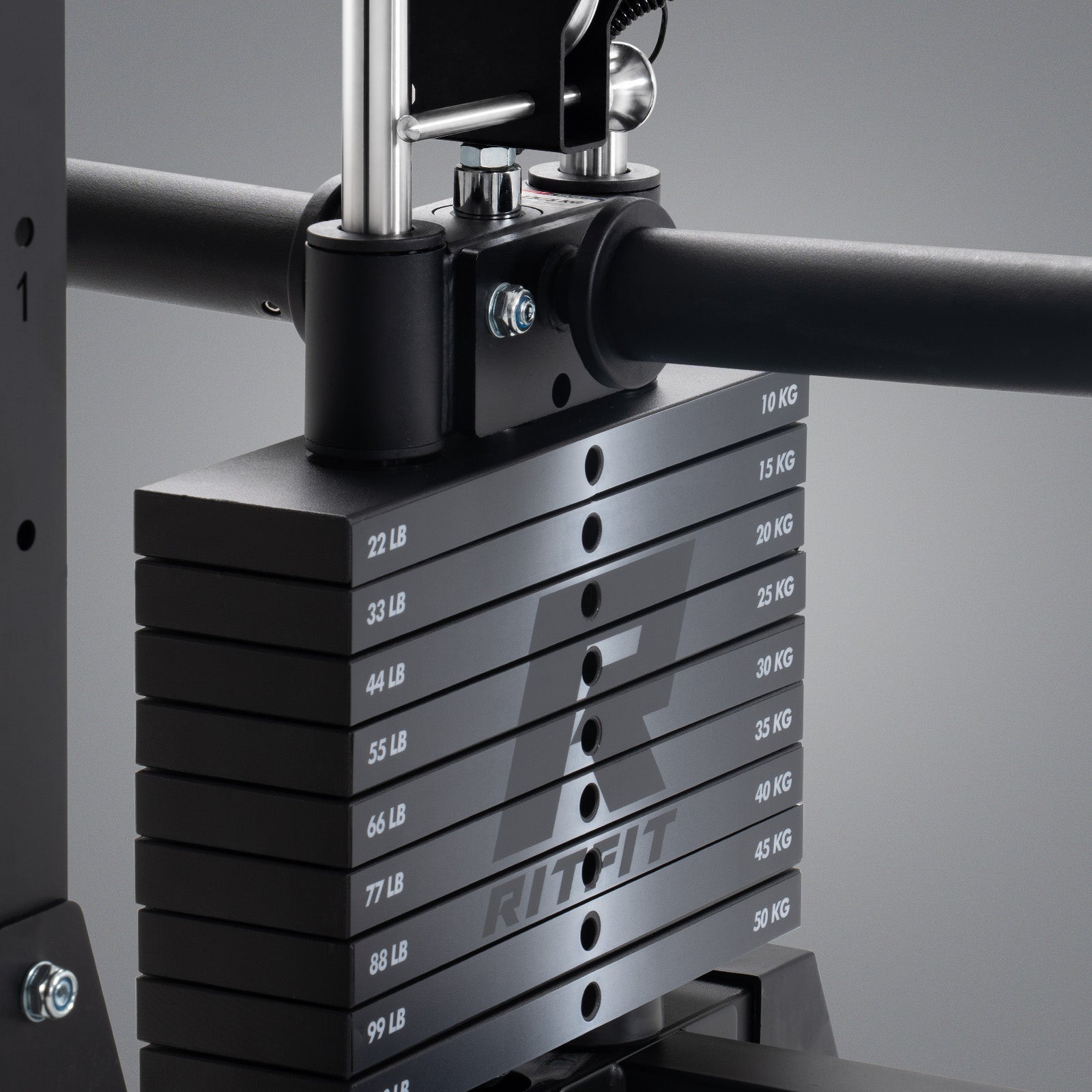 Black weight stack with dual lb and kg markings on RitFit P9 Multi-Functional Modular Power Cage