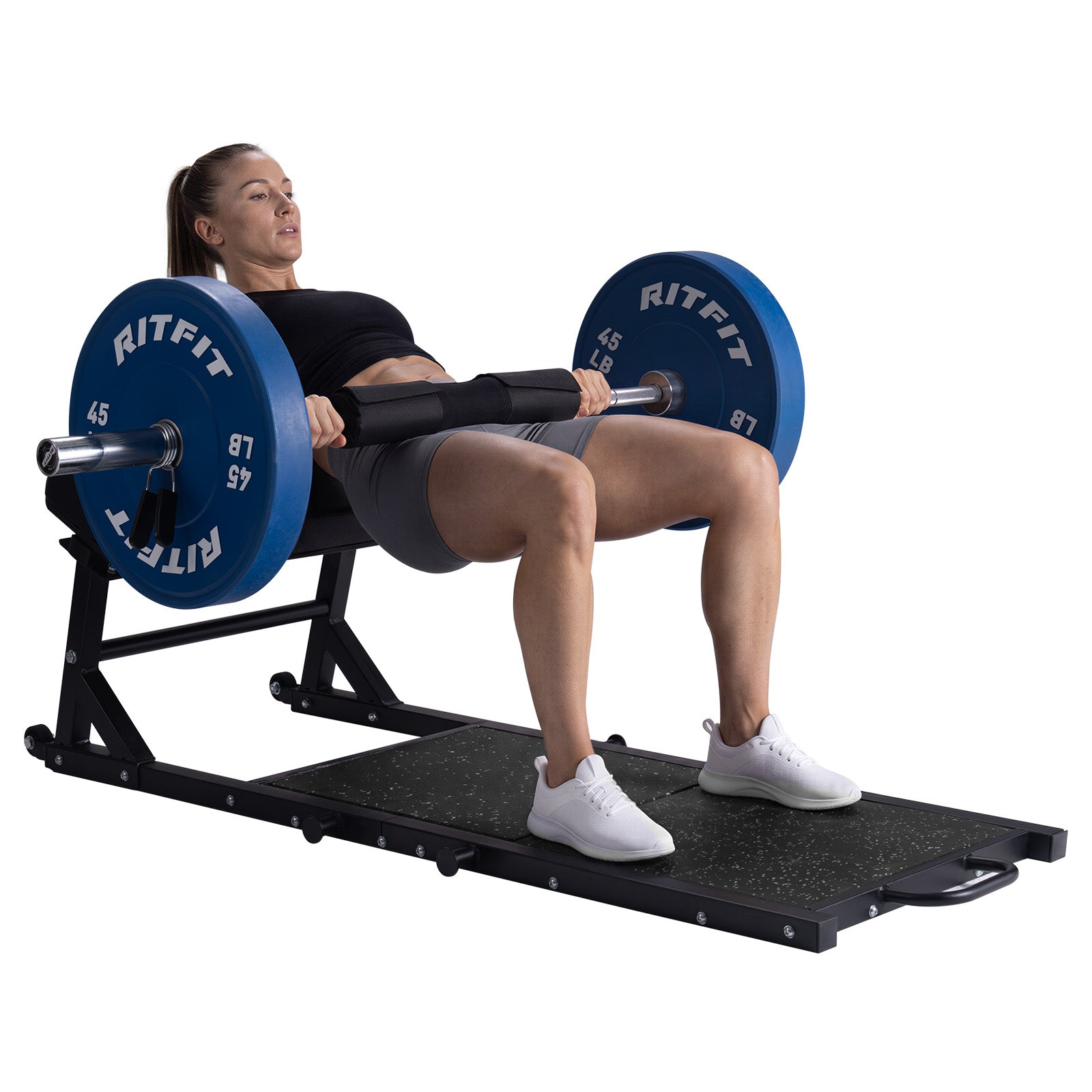Woman performing hip thrust exercise on black RitFit PHM02 Hip Thrust Machine with blue weight plates