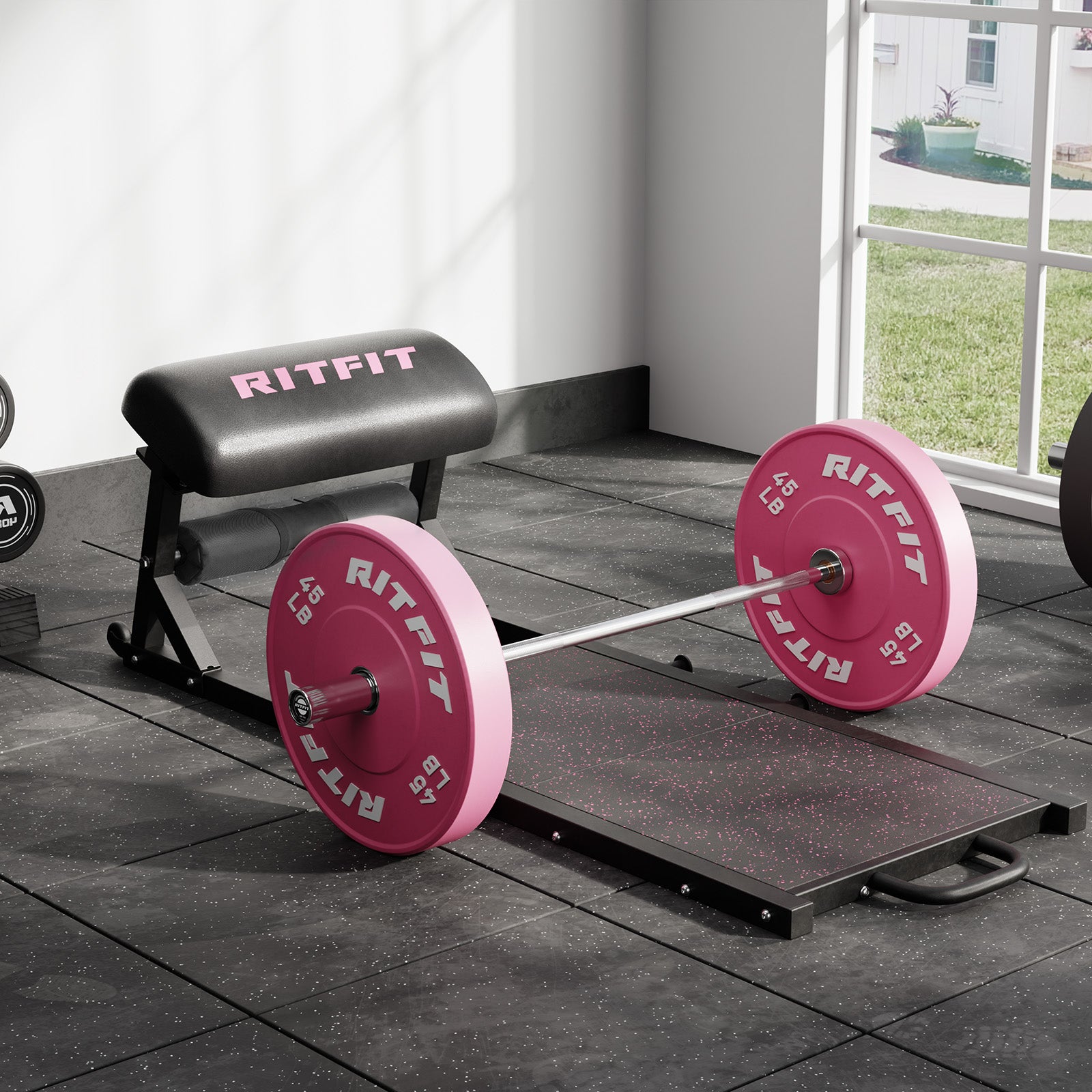 Black RitFit PHM02 Hip Thrust Machine with pink bumper plates on rubber gym floor