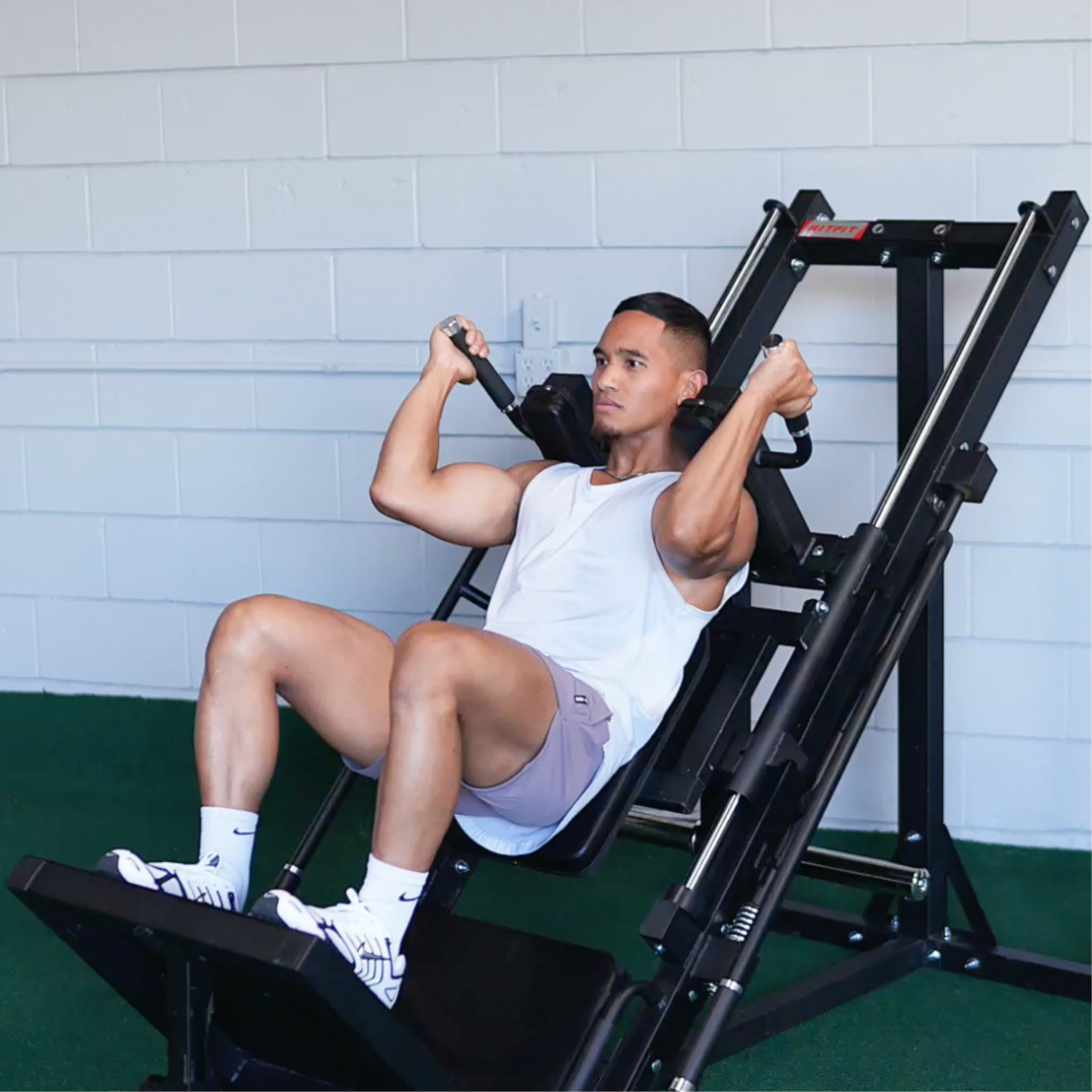 Athlete training lower body on RitFit BLP01 hack squat and leg press machine