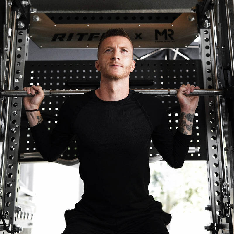 Marco Reus performing a back squat on the RitFit M3 Smith machine