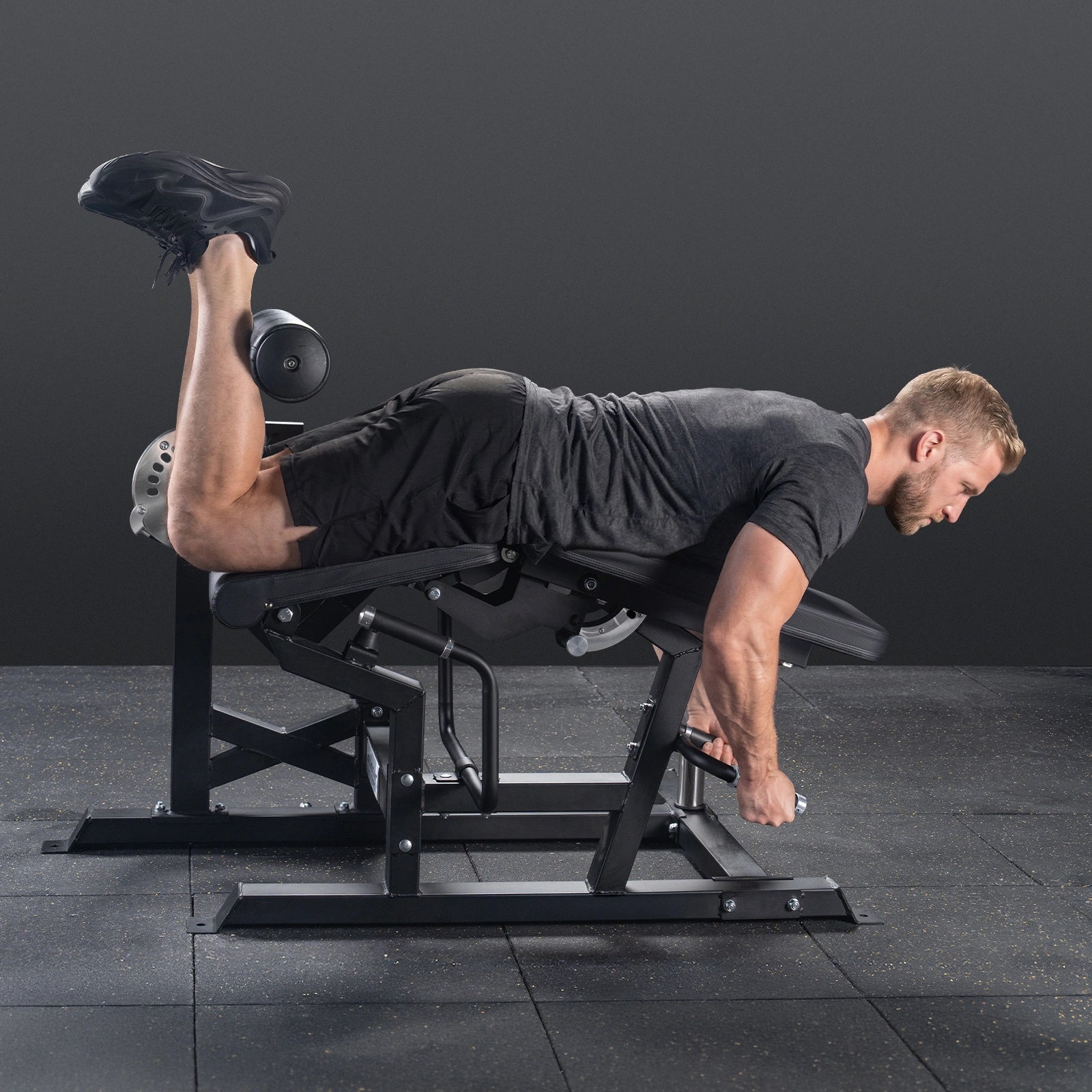 RitFit Mustang PRO leg extension and curl machine for strength training, shown in a gym setting with adjustable components.